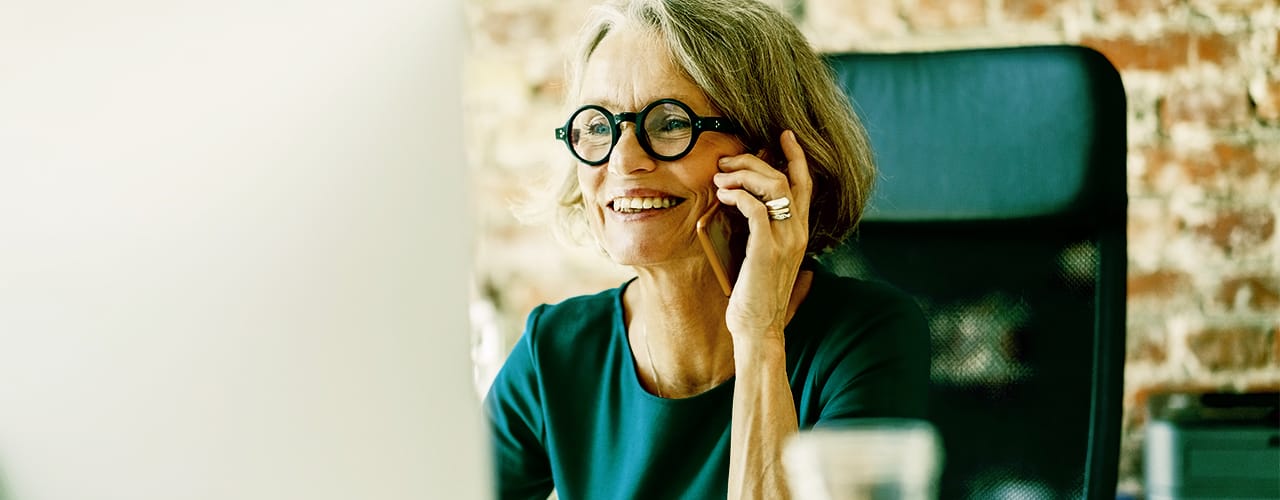 Photo of a older female talking on a mobile phone